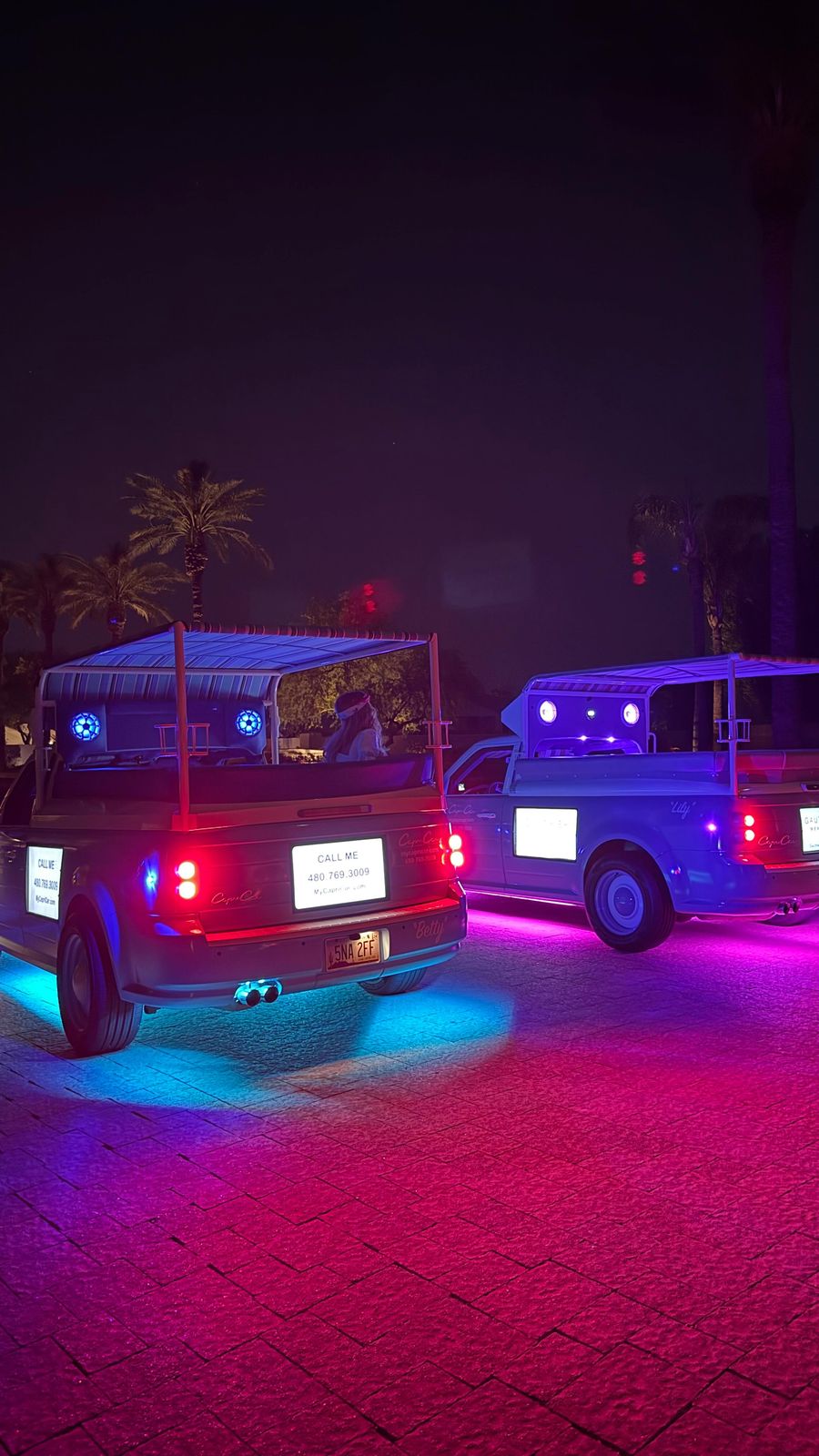 Two Capri Cars at night with blue and pink underglow